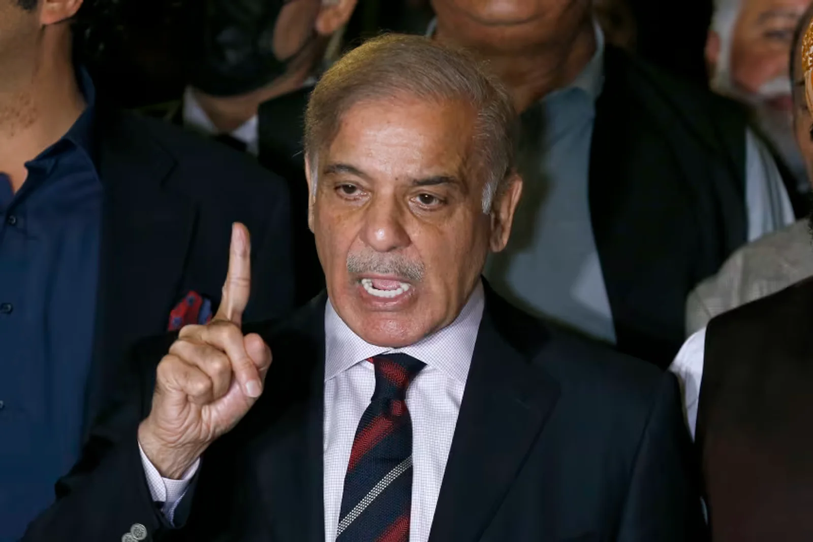 Pakistani Prime Minister Shehbaz Sharif speaking at a podium